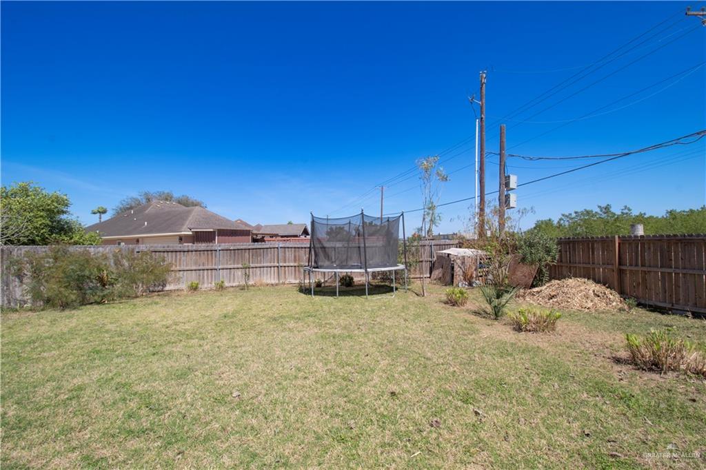 1307 Rio Grande Street San Juan, TX 78589 - Photo 22 of 23 a view of a house with a backyard