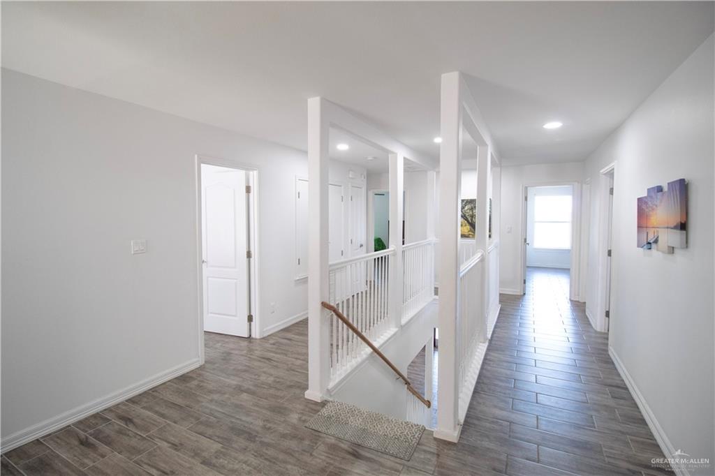 1307 Rio Grande Street San Juan, TX 78589 - Photo 10 of 23 a view of a hallway with wooden floor
