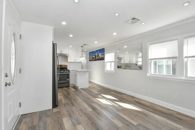 a view of kitchen with wooden floor