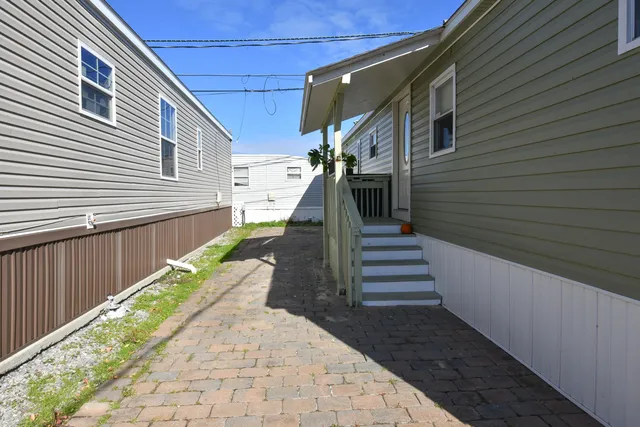 a view of a pathway with a patio