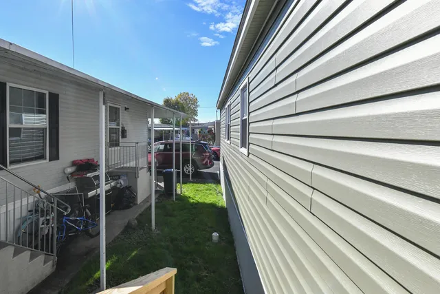 a view of a backyard with sitting area