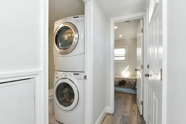 a view of a hallway with washer and dryer