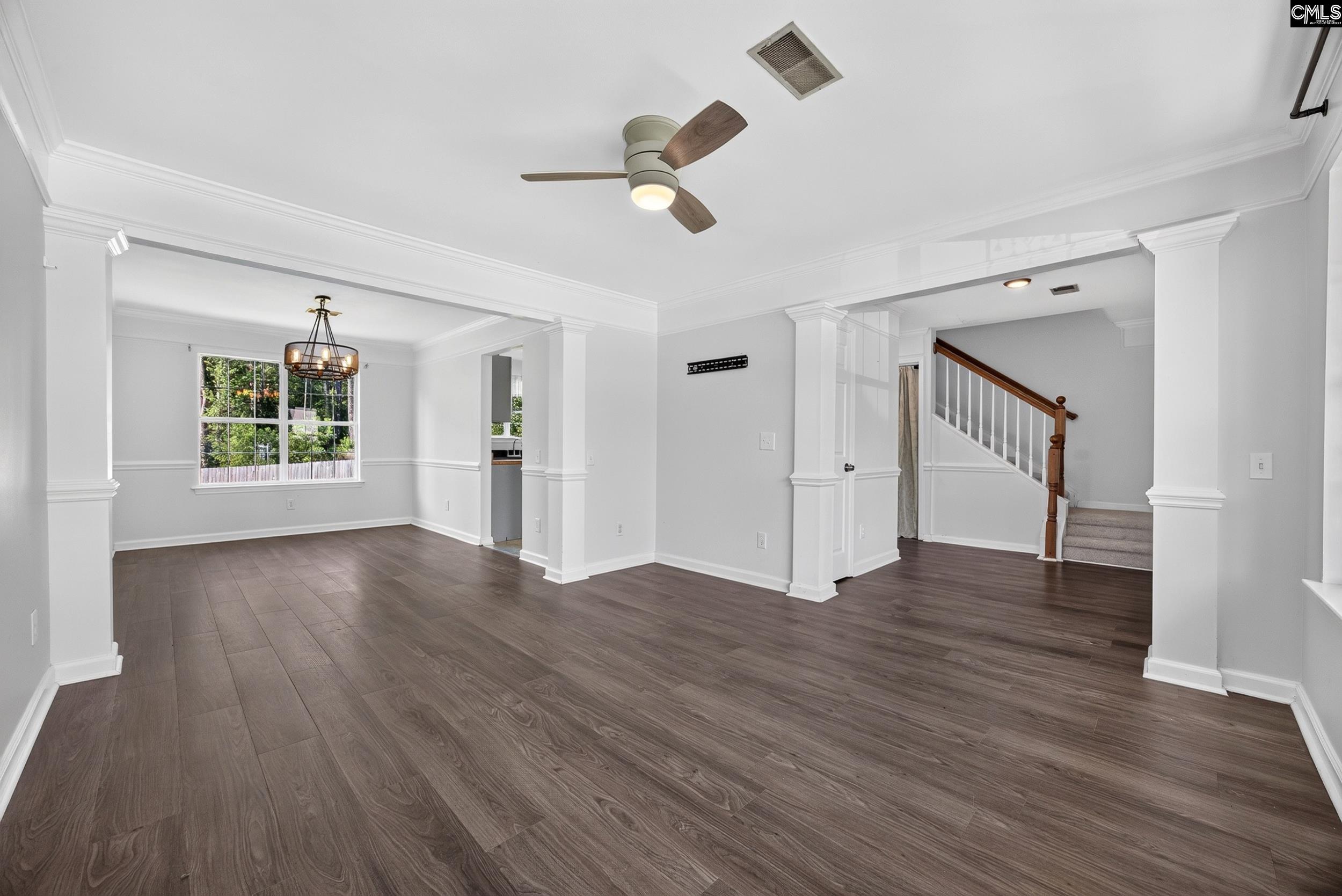 407 Sesqui Trail Columbia, SC 29223 - Photo 9 of 34 an empty room with wooden floor and windows