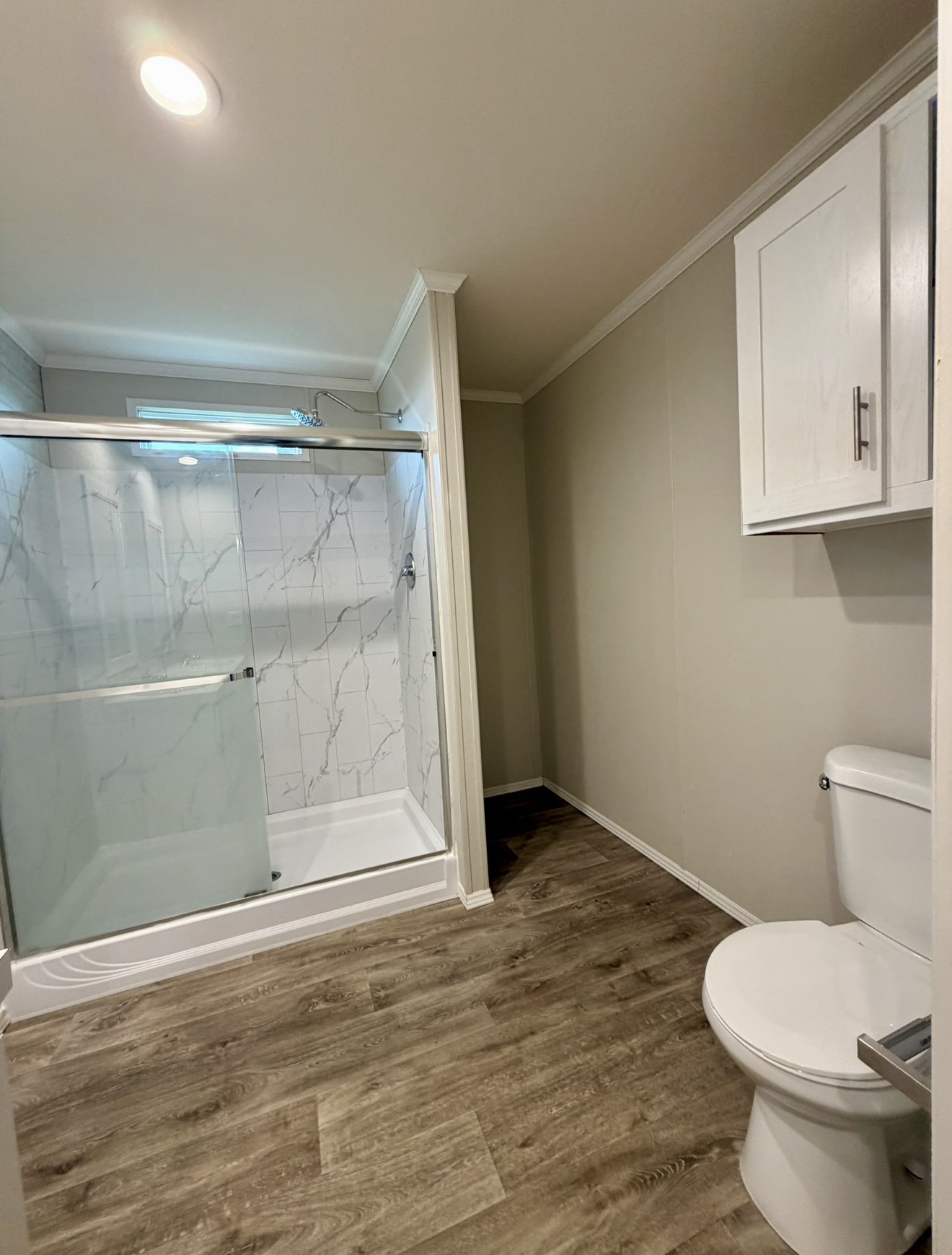 126 Castellana Way Elgin, TX 78621 - Photo 12 of 19 a bathroom with a toilet and a shower