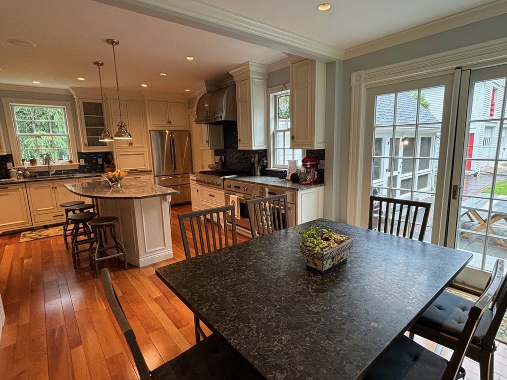 674 Webster Street Needham, MA 02492 - Photo 5 of 10 a dining room with furniture and wooden floor