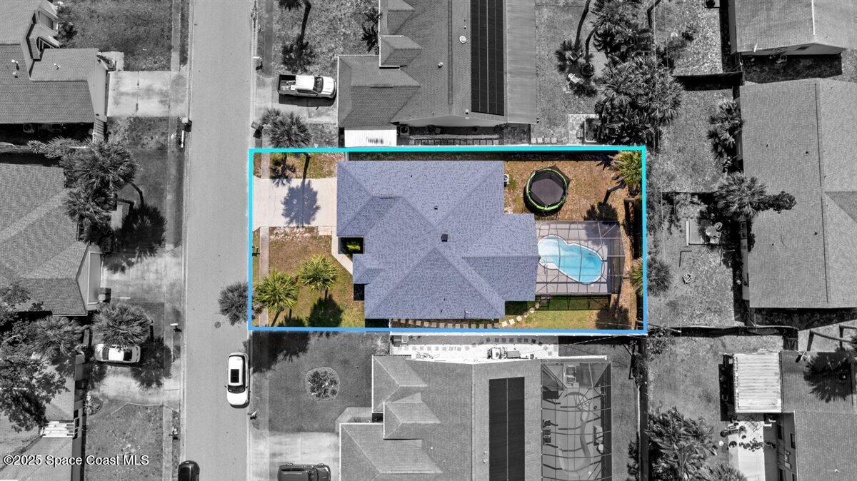 1709 Palm Ridge Road Melbourne, FL 32935 - Photo 3 of 43 an aerial view of residential houses with outdoor space