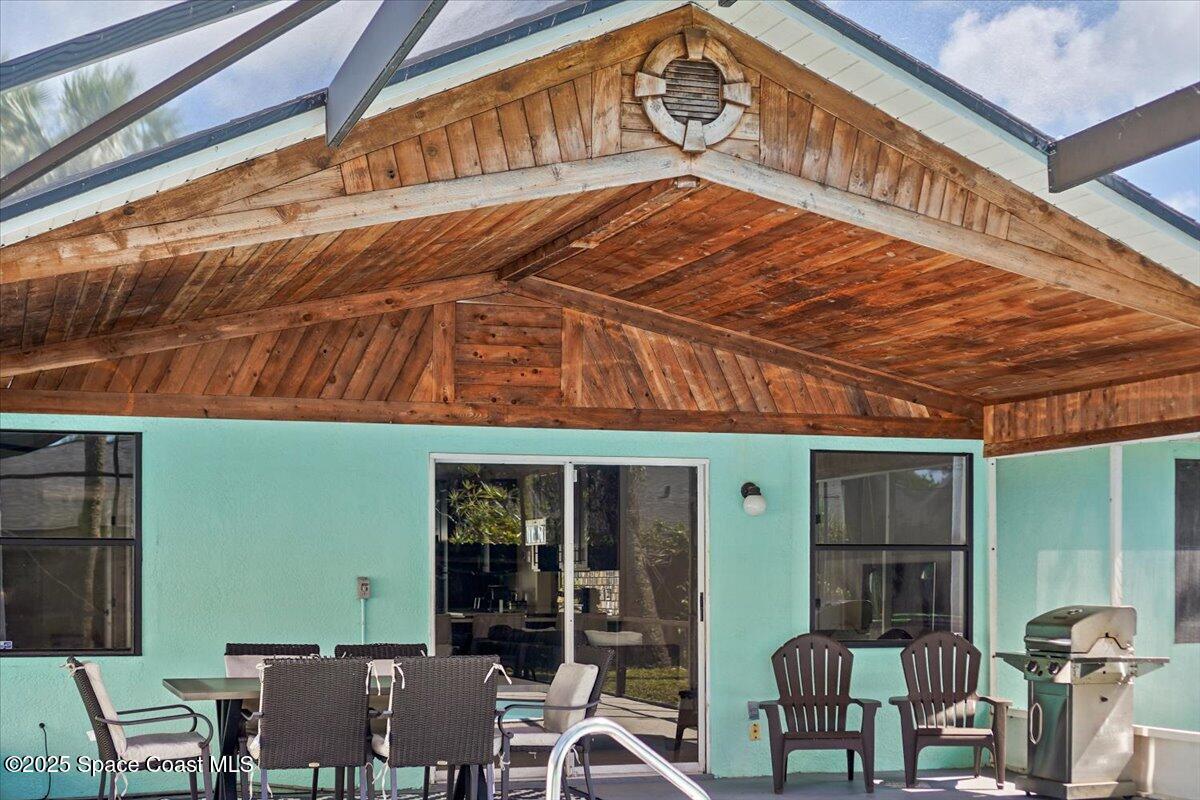 1709 Palm Ridge Road Melbourne, FL 32935 - Photo 35 of 43 a view of a two chairs in the patio