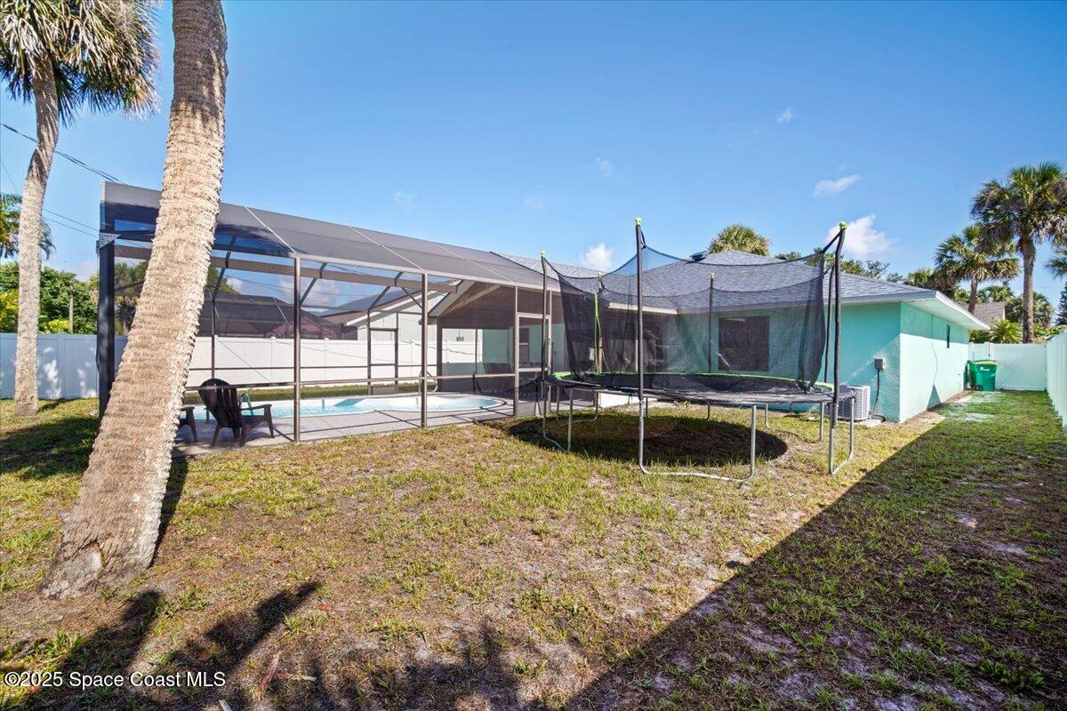 1709 Palm Ridge Road Melbourne, FL 32935 - Photo 39 of 43 a view of a house with swimming pool and porch