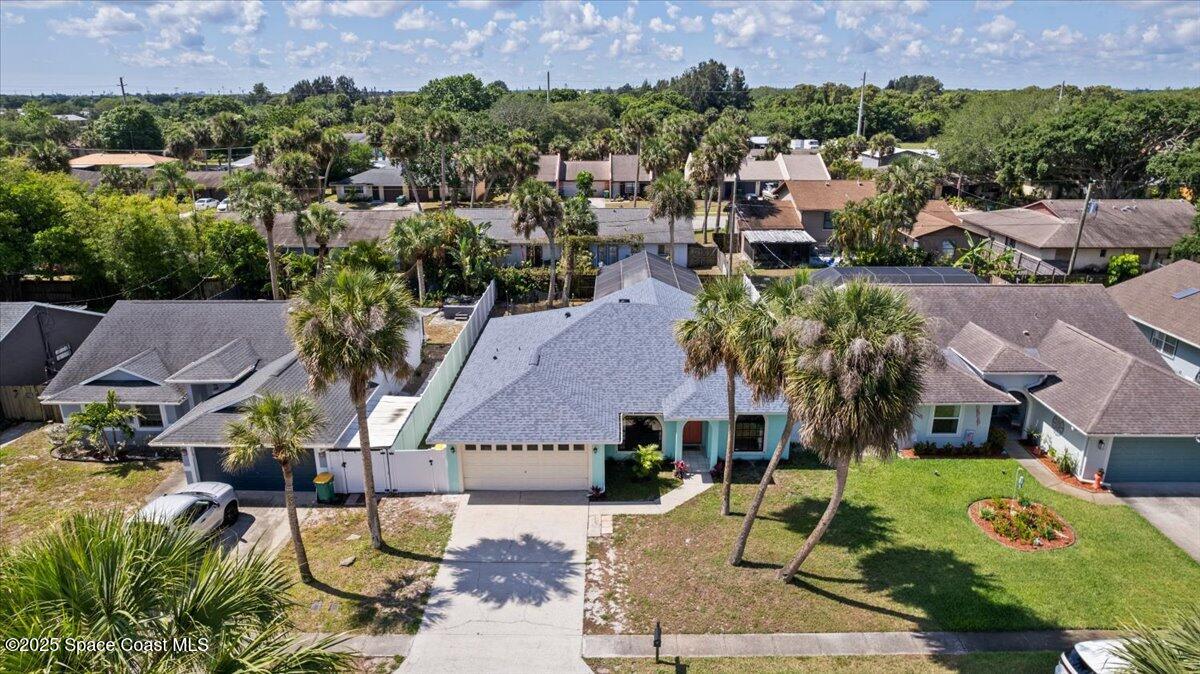 1709 Palm Ridge Road Melbourne, FL 32935 - Photo 41 of 43 an aerial view of multiple house