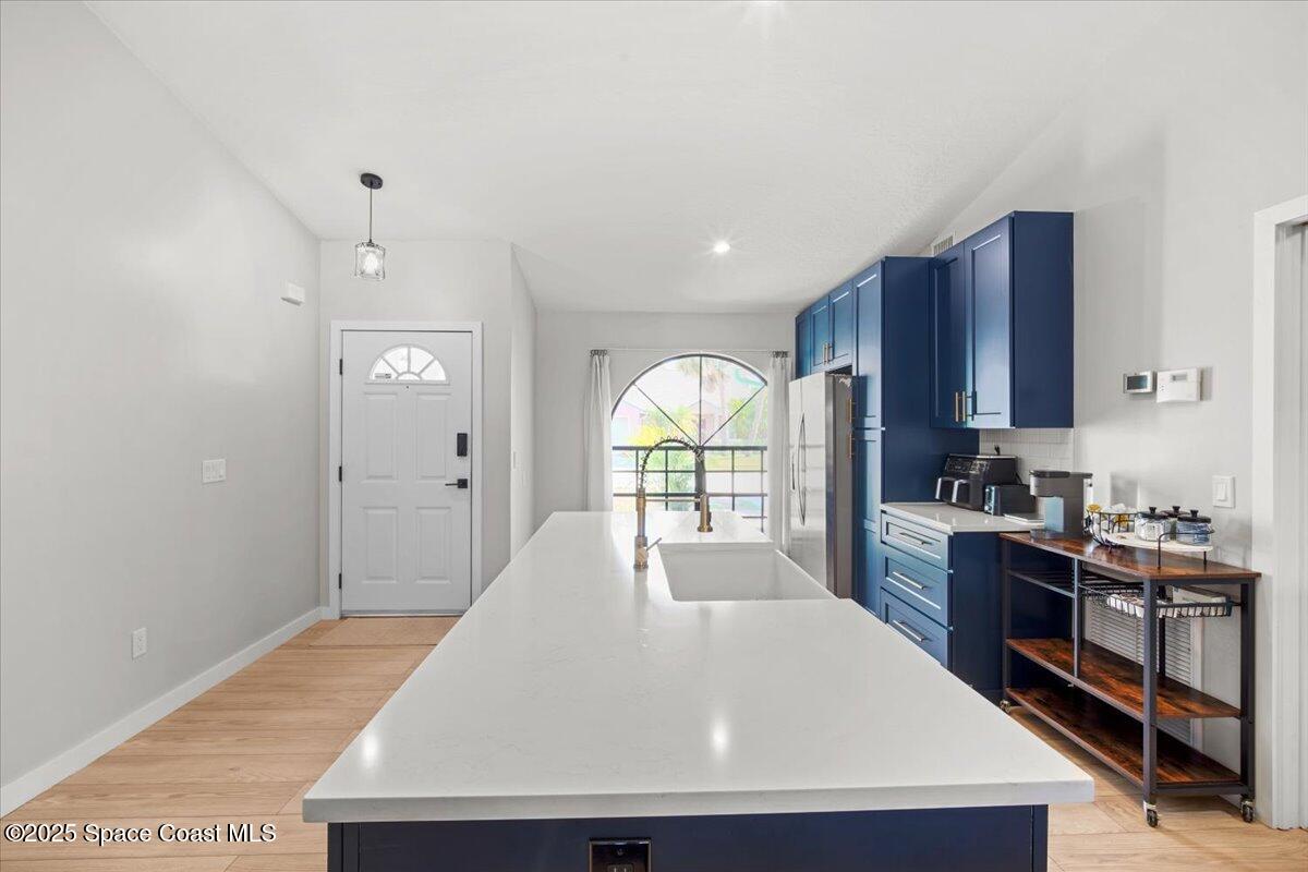 1709 Palm Ridge Road Melbourne, FL 32935 - Photo 6 of 43 a large kitchen with stainless steel appliances granite countertop a stove a sink dishwasher and a wooden cabinets