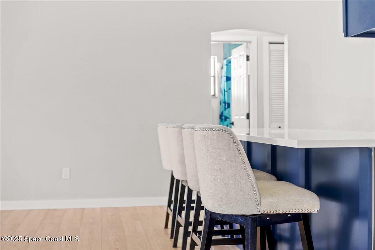 1709 Palm Ridge Road Melbourne, FL 32935 - Photo 8 of 43 a view of a dining room with furniture