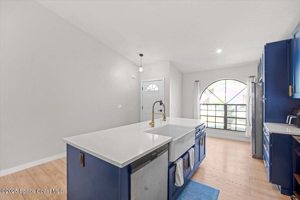 1709 Palm Ridge Road Melbourne, FL 32935 - Photo 9 of 43 a kitchen with a sink and a window