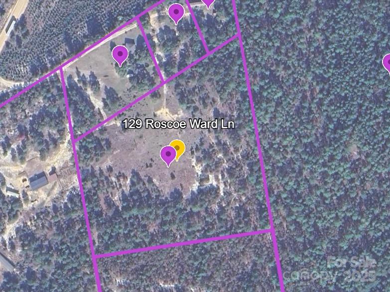 129 Roscoe Ward Lane Patrick, SC 29584 - Photo 2 of 3 a street sign that is on a brick wall