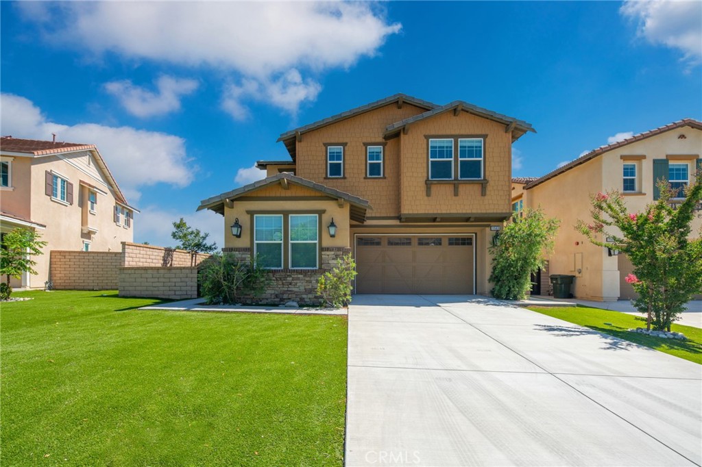 11563 Grimaldi Road Rancho Cucamonga, CA 91701 - Photo 1 of 1 a front view of a house with a yard and garage