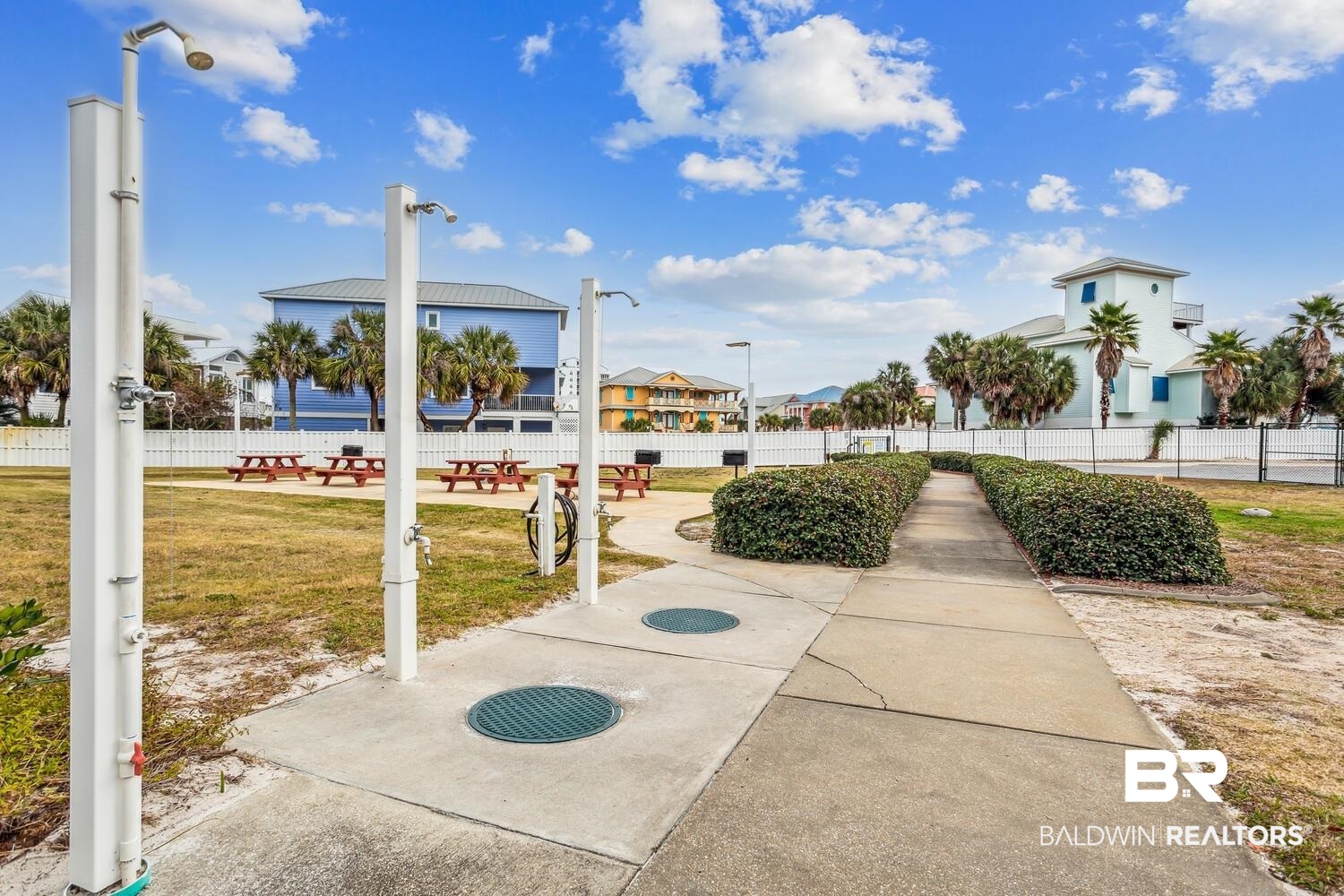 13551 Johnson Beach Road, Unit 112E Pensacola, FL 32507 - Photo 26 of 42 Surrounding community featuring a lawn and a patio area