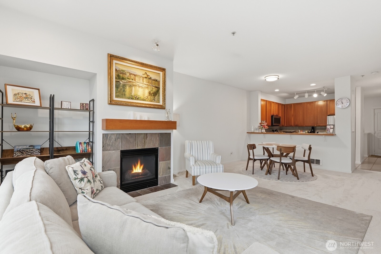 2000 Alaskan Way, Unit 553 Seattle, WA 98121 - Photo 11 of 33 a living room with furniture and a fireplace