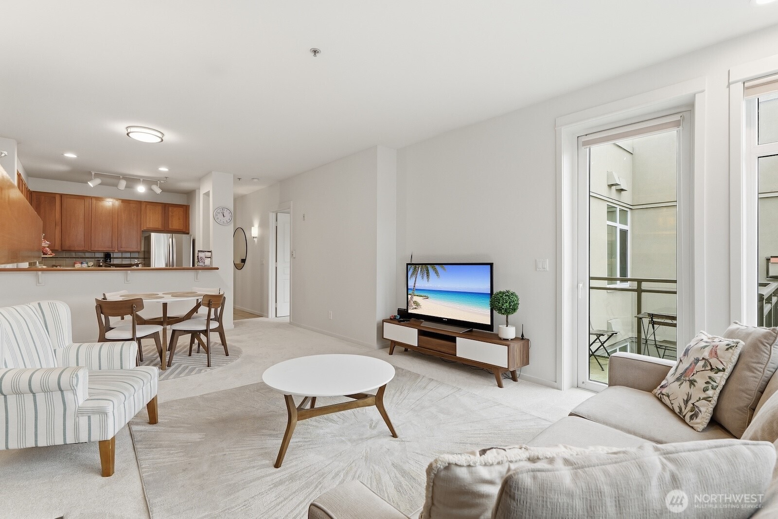 2000 Alaskan Way, Unit 553 Seattle, WA 98121 - Photo 12 of 33 a living room with furniture and a painting on the wall