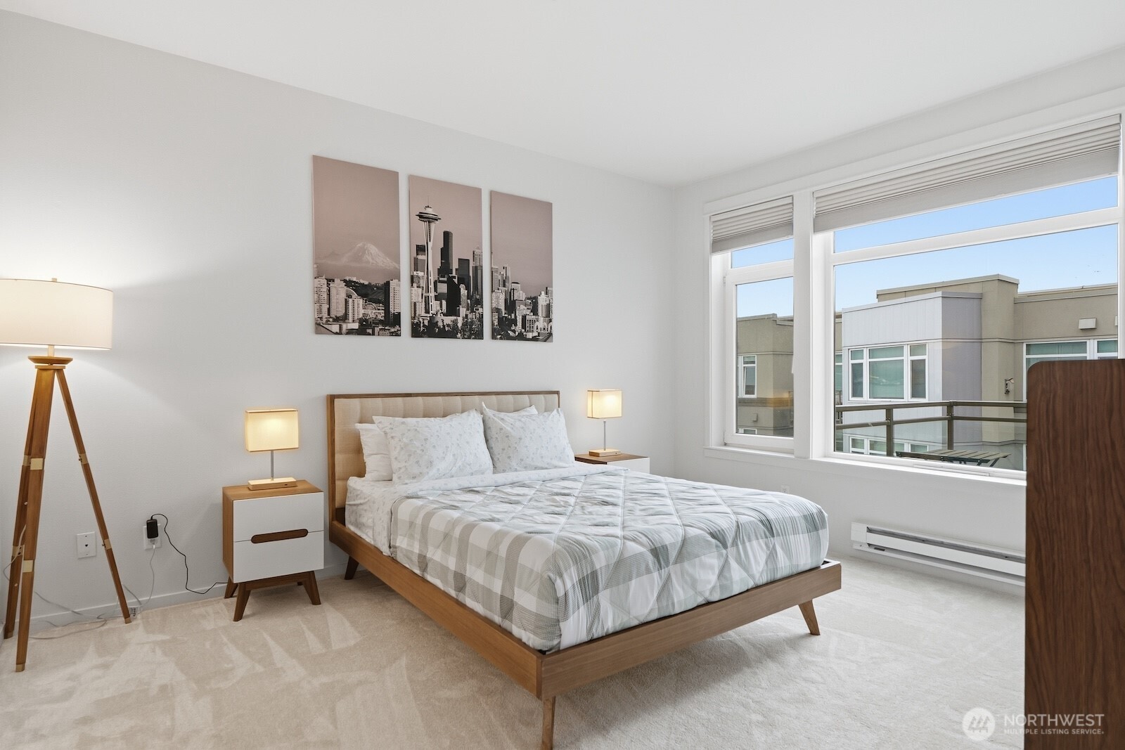 2000 Alaskan Way, Unit 553 Seattle, WA 98121 - Photo 18 of 33 a bedroom with a bed and a large window