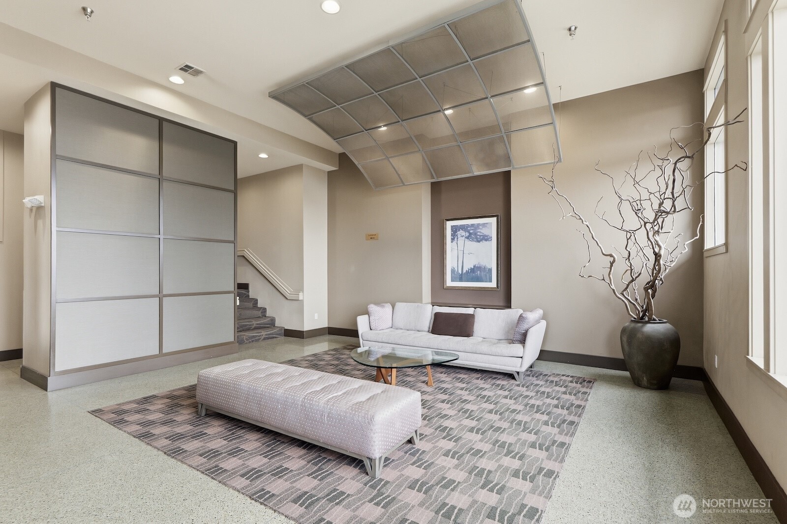 2000 Alaskan Way, Unit 553 Seattle, WA 98121 - Photo 26 of 33 a living room with furniture and a rug
