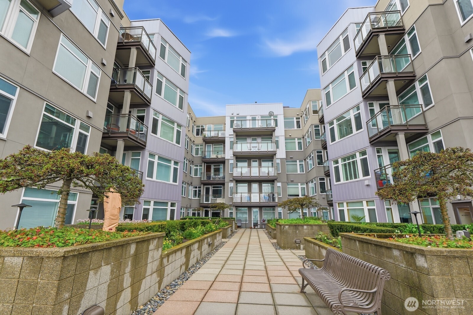 2000 Alaskan Way, Unit 553 Seattle, WA 98121 - Photo 27 of 33 a view of a brick building next to a yard
