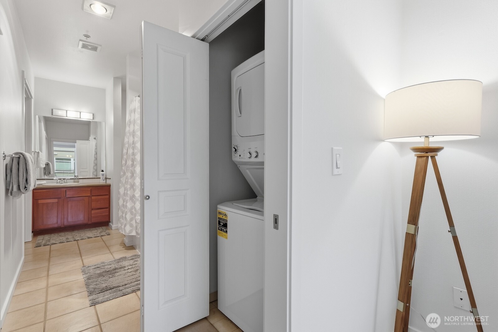 2000 Alaskan Way, Unit 553 Seattle, WA 98121 - Photo 6 of 33 a bathroom with a sink and a mirror