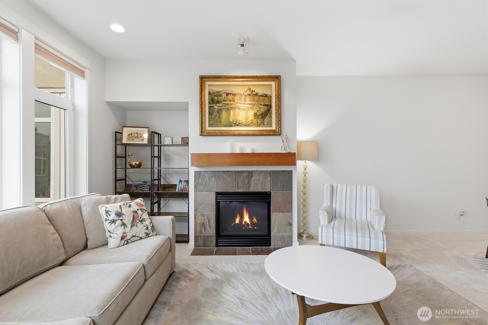 2000 Alaskan Way, Unit 553 Seattle, WA 98121 - Photo 7 of 33 a living room with furniture and a fireplace