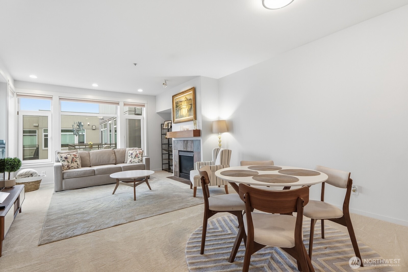 2000 Alaskan Way, Unit 553 Seattle, WA 98121 - Photo 8 of 33 a view of a livingroom with furniture and a fireplace