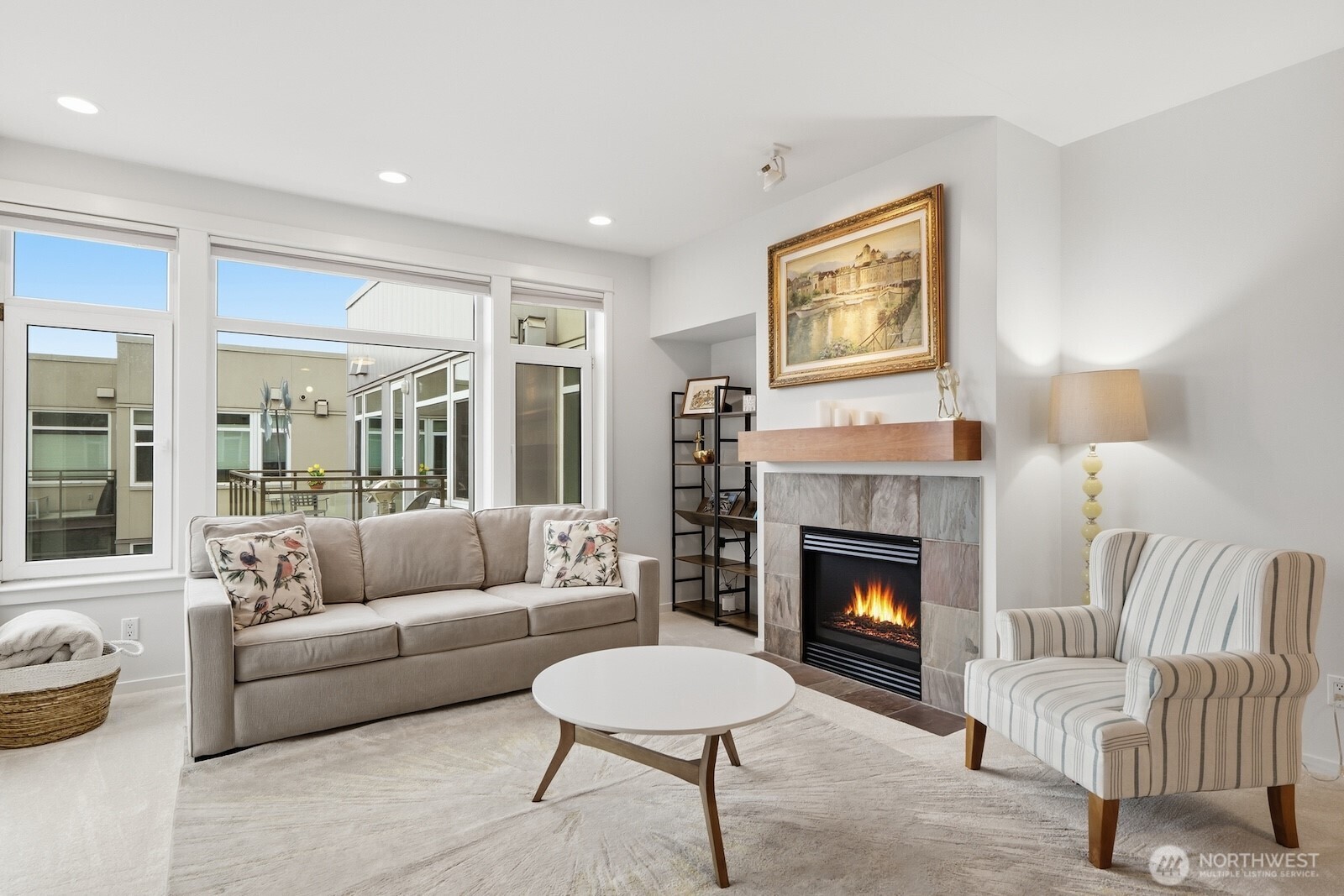 2000 Alaskan Way, Unit 553 Seattle, WA 98121 - Photo 10 of 33 a living room with furniture and a fireplace