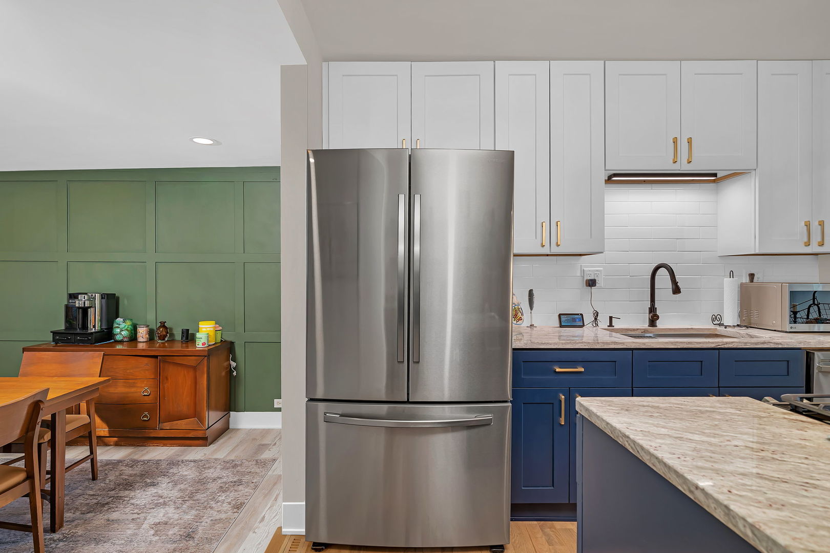 128 South Villa Avenue Addison, IL 60101 - Photo 11 of 43 a kitchen with stainless steel appliances granite countertop a refrigerator sink and cabinets
