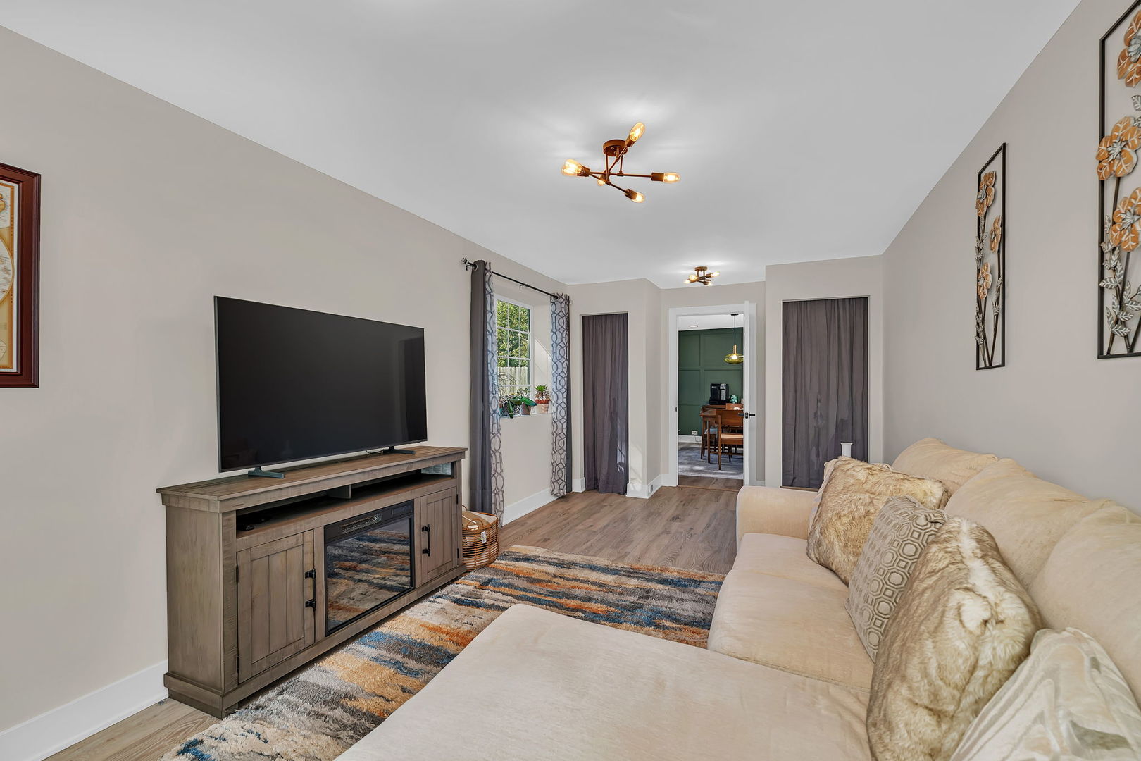 128 South Villa Avenue Addison, IL 60101 - Photo 16 of 43 a bedroom with furniture and flat screen tv