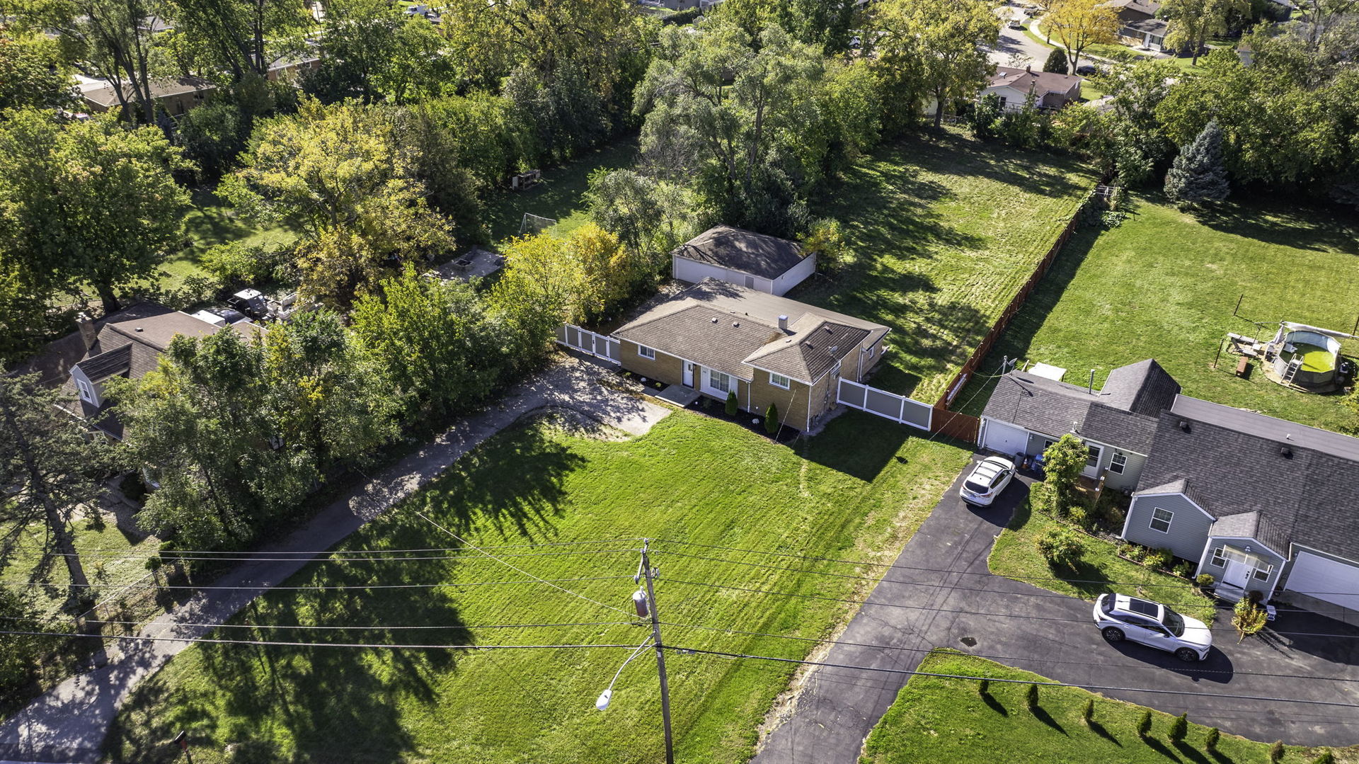 128 South Villa Avenue Addison, IL 60101 - Photo 34 of 43 an aerial view of a house with swimming pool and garden
