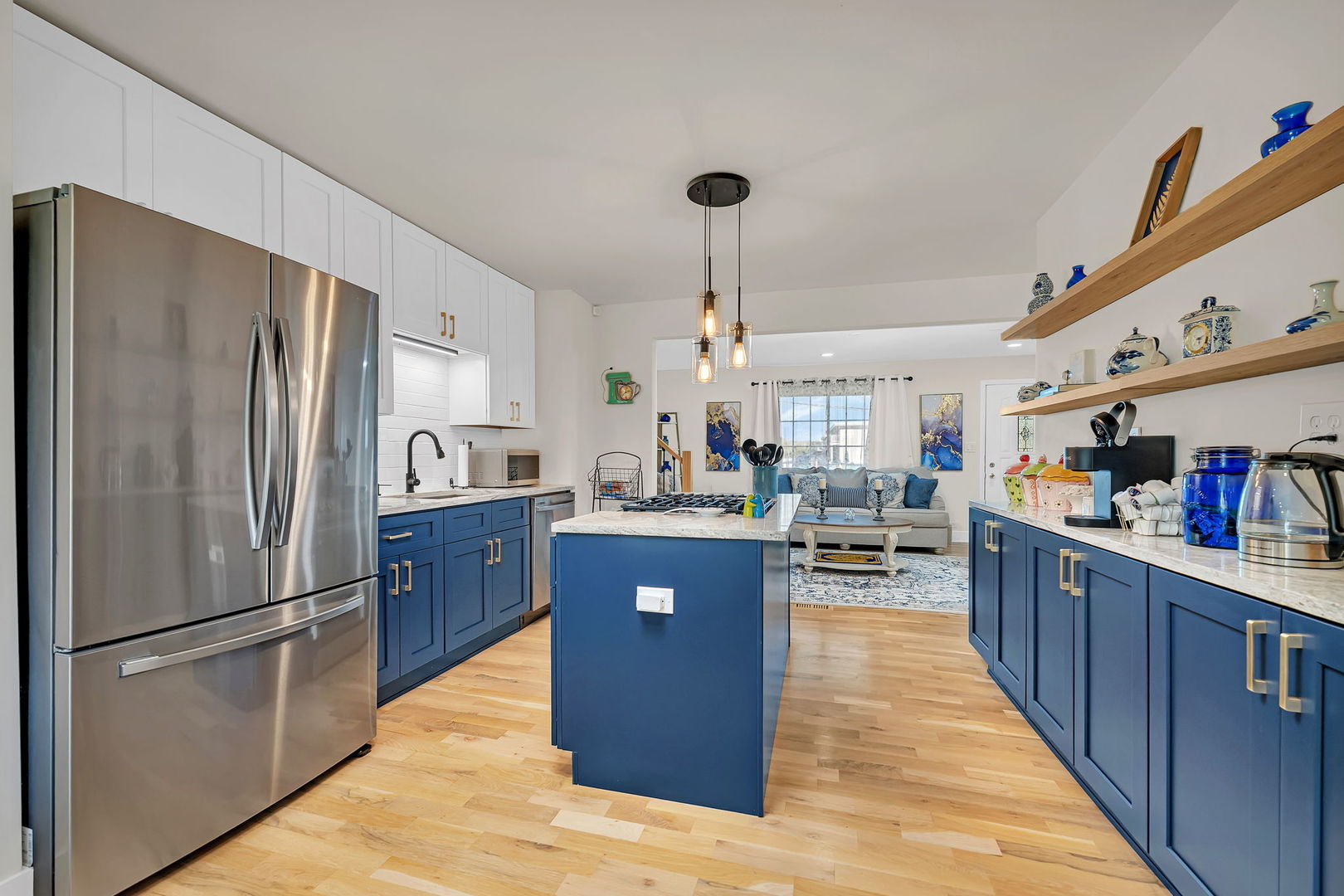 128 South Villa Avenue Addison, IL 60101 - Photo 7 of 43 a large kitchen with stainless steel appliances granite countertop a refrigerator and a wooden cabinets