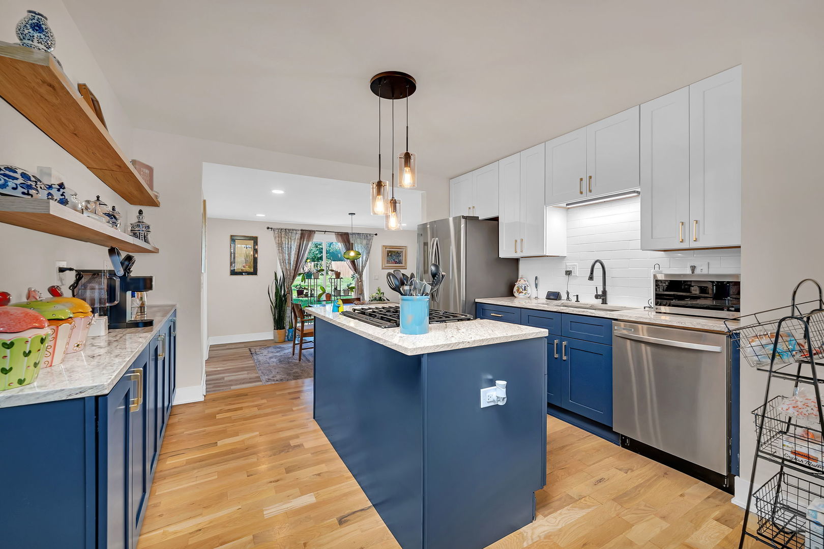 128 South Villa Avenue Addison, IL 60101 - Photo 10 of 43 a kitchen with stainless steel appliances a sink stove and refrigerator