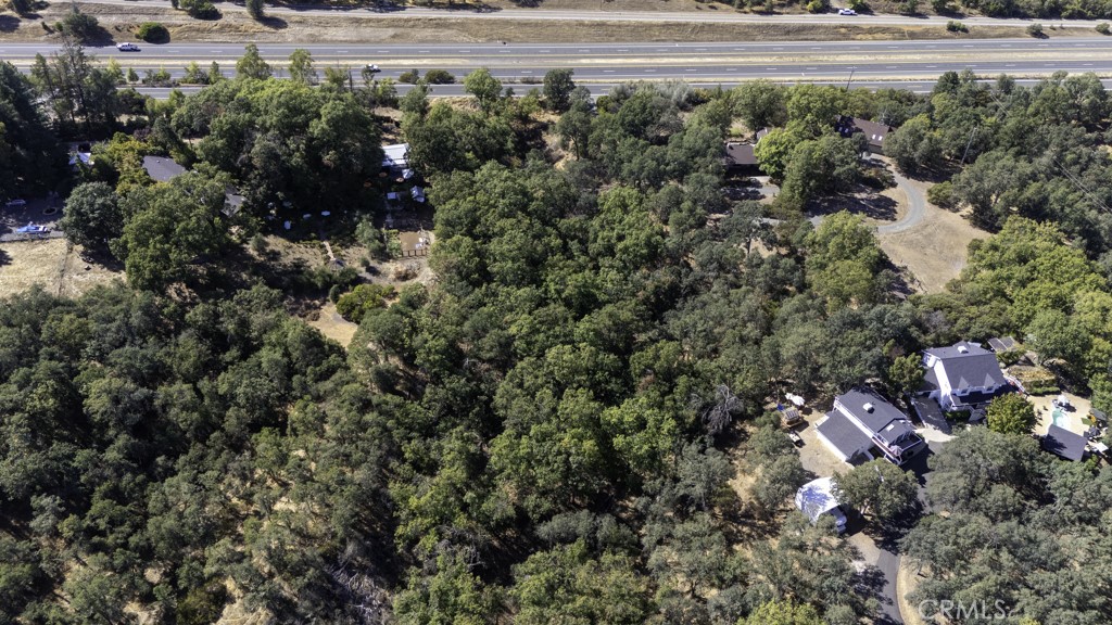2702 Hill Road East Lakeport, CA 95453 - Photo 9 of 16 a view of a house with a yard and garden