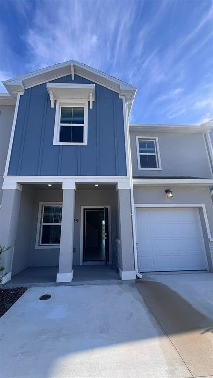a front view of a house with a garage