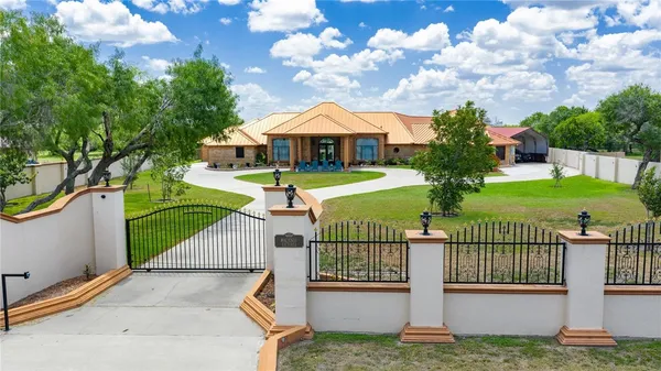 a front view of a house with garden
