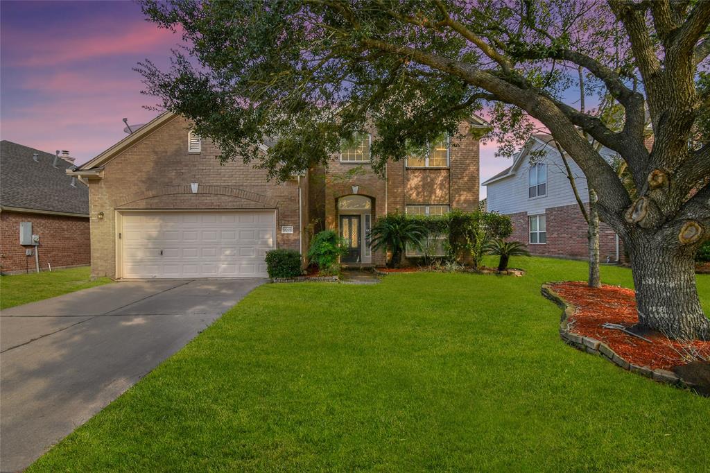 9005 Sundown Drive Pearland, TX 77584 - Photo 1 of 30 Welcome 9005 Sundown, a stunning, fully renovated home with a timeless red brick façade, lush landscaping, and a light-filled formal entry.