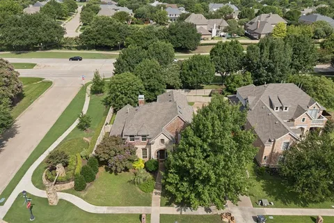 an aerial view of a house with yard swimming pool and outdoor seating