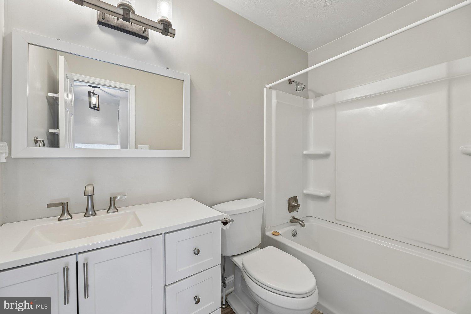 15764 Beau Ridge Drive Woodbridge, VA 22193 - Photo 31 of 58 a bathroom with a sink a toilet and shower