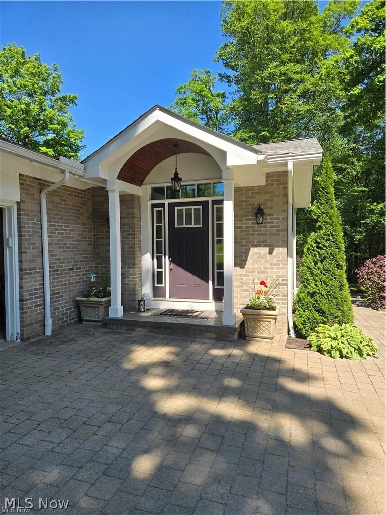 13725 Rockhaven Road Newbury, OH 44065 - Photo 3 of 31 Paver garage entrance