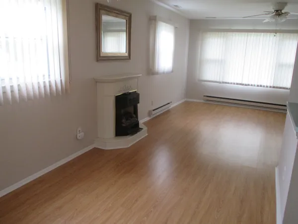 a view of wooden floor and chandelier in a room