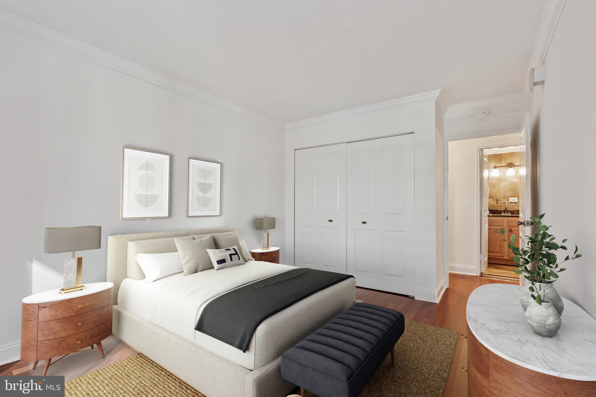 1900 John F Kennedy Boulevard, Unit 702 Philadelphia, PA 19103 - Photo 13 of 27 a bedroom with a bed and a table