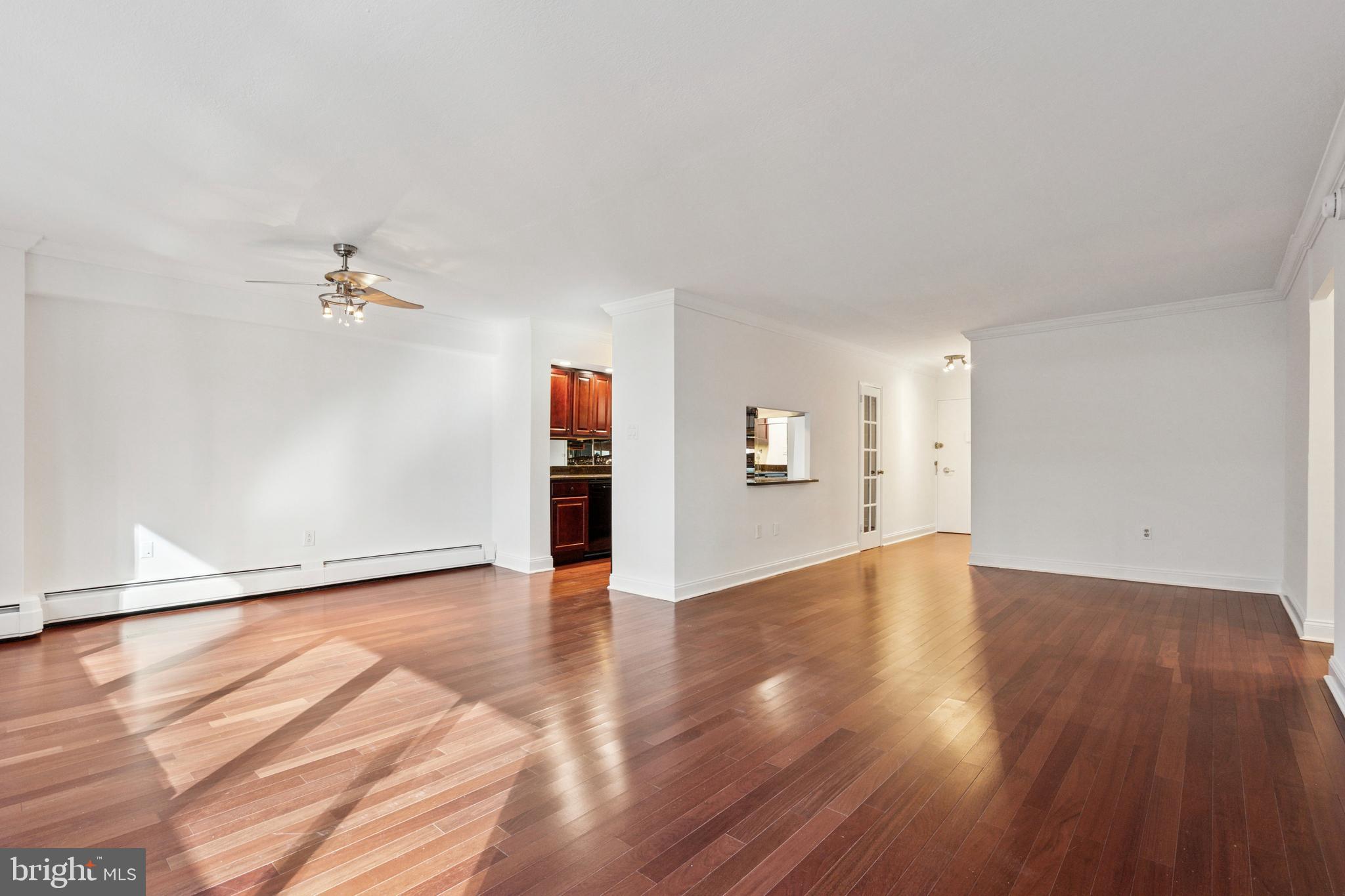 1900 John F Kennedy Boulevard, Unit 702 Philadelphia, PA 19103 - Photo 2 of 27 a view of an empty room with wooden floor