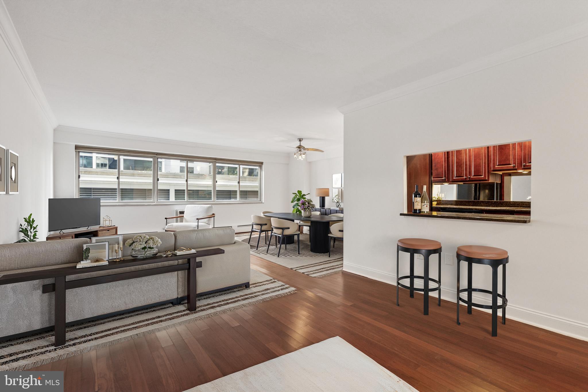 1900 John F Kennedy Boulevard, Unit 702 Philadelphia, PA 19103 - Photo 3 of 27 a living room with furniture and a wooden floor