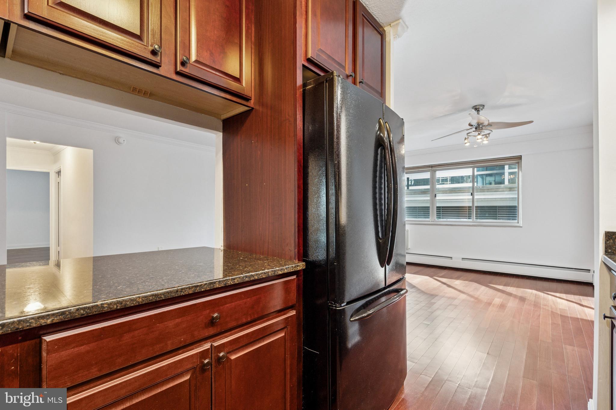 1900 John F Kennedy Boulevard, Unit 702 Philadelphia, PA 19103 - Photo 10 of 27 a view of an empty room with wooden floor and a window