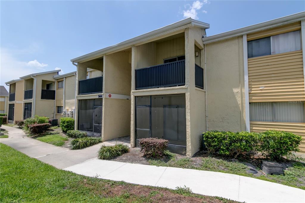 944 Lake Destiny Road, Unit F Altamonte Springs, FL 32714 - Photo 1 of 17 a front view of a house with garden