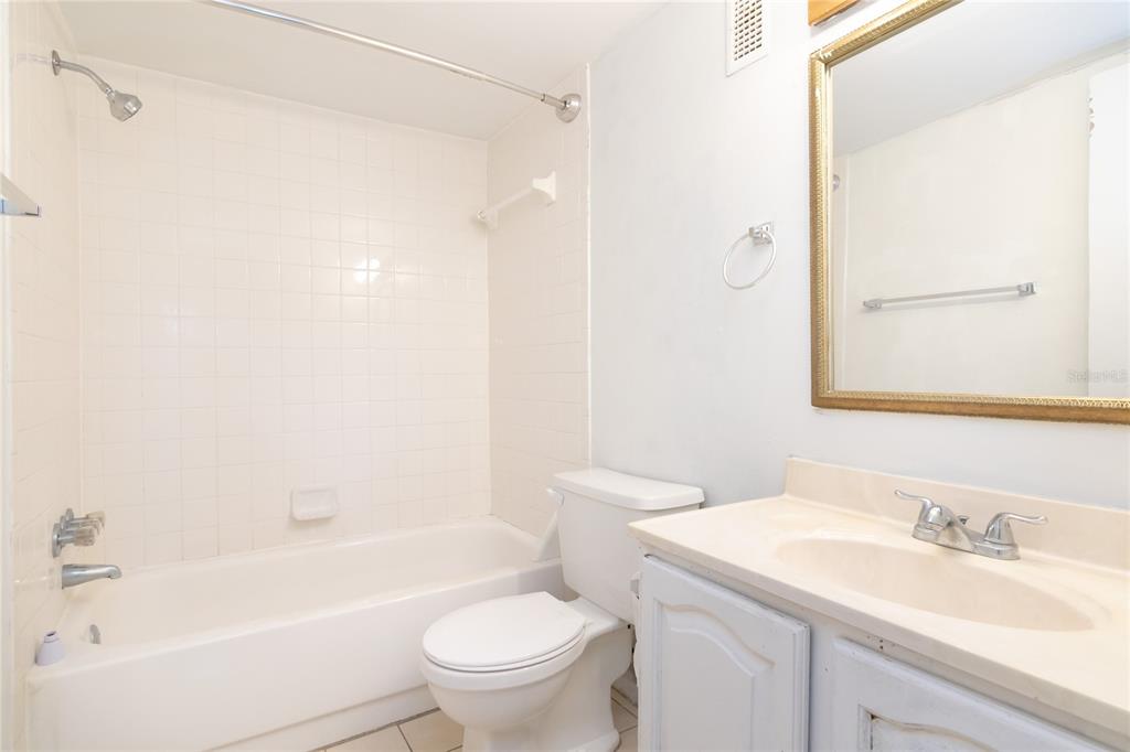 944 Lake Destiny Road, Unit F Altamonte Springs, FL 32714 - Photo 14 of 17 a bathroom with a sink toilet and shower
