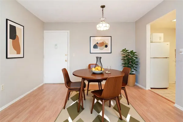 a view of a dining room with furniture and wooden floor