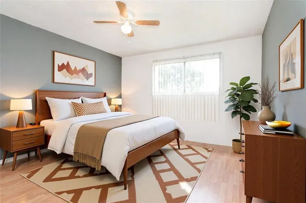 a bedroom with bed and a window