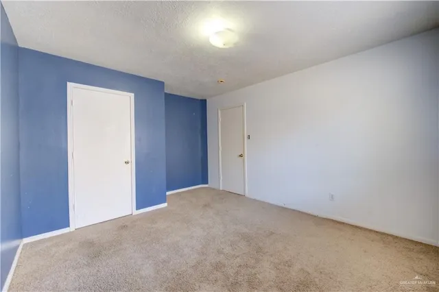 a view of a big room with a window